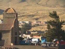 Catholic Church exterior in Cala Cala, Bolivia during spring festival Stock Footage