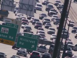 Long lens, overhead, huge traffic congestion on hot interstate highway. Stock Footage