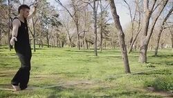 practicing balance on the rope outdoors Stock Footage