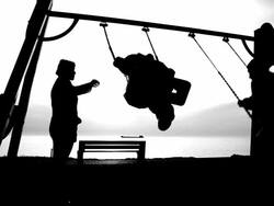 woman with children on a swing on the coast Stock Footage