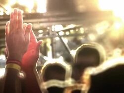 Hands in air in sunset Stock Footage