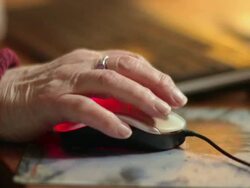 Elderly hand on a computer mouse, time lapse Stock Footage