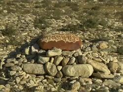 Pull Back Shot group of mani stones and mountains Lhasa Tibet China Stock Footage