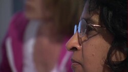 Clinton activists hearing a pep talk News Clip