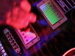 CU hand strumming guitar on stage/Norwich/Norfolk/UK Stock Footage