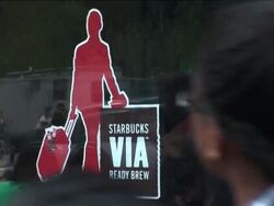 Starbucks's unveiled its newest offering Tuesday, blanketing the nation with thousands of free samples of its instant coffee called Via.(Sept. 29) News Clip