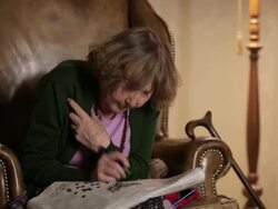 MS Senior woman playing crossword puzzle in newspaper  / Berlin, Germany Stock Footage