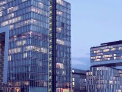 WS T/L View of office buildings at dusk / Cologne, North Rhine-Westphalia, Germany   Stock Footage