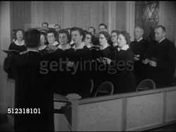 1952: ST. JOHN'S EVANGELICAL LUTHERAN CHURCH: ELKHORN: VS Reverend Charles Burmeister giving sermon & saying prayers, church choir singing various Christmas carols, male conductor, female organ player. Wisconsin, WI, religion, Xmas, holidays, winter Instructional Video