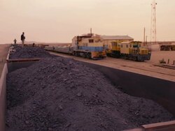 Mauritanian train carrying iron ore and passengers Stock Footage
