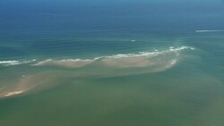 Waves wash over a sandbar in the Atlantic Ocean. Stock Footage