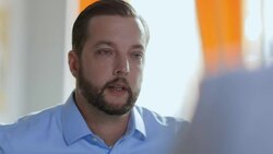 Small business owner instructs staff in daily team meeting Stock Footage