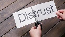 woman's hands cut paper by scissors on pattern wood plank Stock Footage