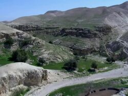  WS AERIAL ZI PAN View of  wadi desert  / Qumran,  Norrn Judea Desert, Israel Stock Footage