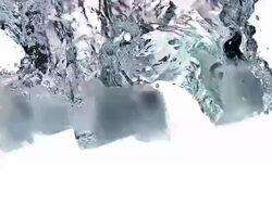 CU SLO MO Ice cubes falling into Water / Vieux Pont, Normandy, France  Stock Footage