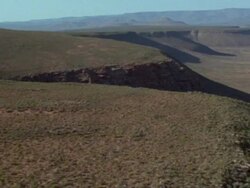 Aerial over river carved into gully, Namaqualand, South Africa Stock Footage