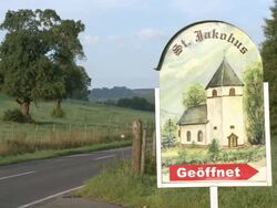 WS Road sign for little church / Fisch, Saargau, Rhineland-Palatinate, Germany Stock Footage