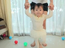 first steps of little asia girl in house Stock Footage