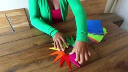 Woman assembling origami in loft space Stock Footage