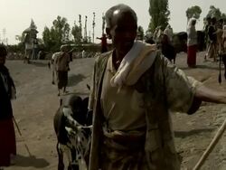 Ethiopian men at camel market Stock Footage