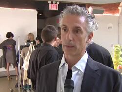 INTERVIEW: Anthony Lilore on his newspaper design at the Leading Eco-Desginers Unveil Newspaper Fashions at Yesterday's News Catwalk at New York NY.  Stock Footage