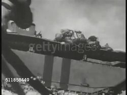 1944: BATTLE OF SAIPAN: TRACKING Japanese aircraft in offshore flight. US Amphibious vehicles landing, Marines on beach. LS Aircraft in flight. WS Bomb explosions. LS Japanese aircraft nose-dive, crashing in jungle, fireball. WWII, Pacific Theater. Instructional Video