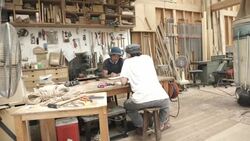 Two craftsmen are meeting in their studio Stock Footage