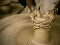 Indian potterâ€™s skilled hand shaping pot on manual pottery wheel Stock Footage
