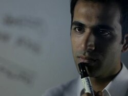 CU R/F ZI Businessman writing on glass wall and thinking / Singapore Stock Footage