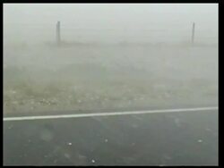 MS large hail stones and torrential rain blowing across road, poor visibility, USA Stock Footage
