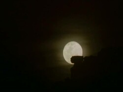 TL moonrise over rocky outcrop and out frame WS, MS, Namaqualand, South Africa Stock Footage