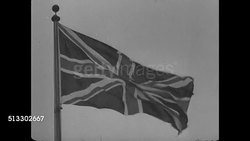 1937: D.O.R.A.: MS British flag. WS English soldiers standing in formation, uniform, rifles at side. MS British flag. VS CU Document 'Defense of the Realm Acts, Alien Restriction Act 1914, Air-Raid Precautions.' England Instructional Video