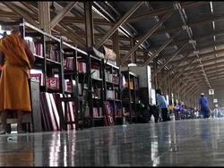 Buddhist Monk Waits At Railway Station Stock Footage