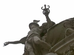 A statue of the Greek god, Mercury, tops a building in New York City. Stock Footage