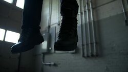 Feet of man who committed suicide by hanging Stock Footage
