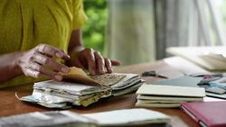 Woman looking through notebook Stock Footage