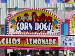 Busy Concession stand at a State Fair with corn dogs, lemonade, nachos and cold drinks. Stock Footage