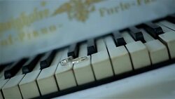 wedding rings on piano Stock Footage
