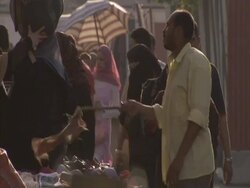 Man dusting his clothes stall, Cairo, Egypt (sound available) Stock Footage