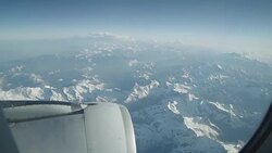 POV of plane flying above Alps Stock Footage