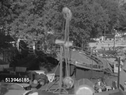 1952: COUNTY FAIR: TIMONIUM, MARYLAND: VS Amusement park rides (Jump and Smile ride), families & people walking around through county fair w/ tents. Carnival, funfair, fayre, festival Instructional Video