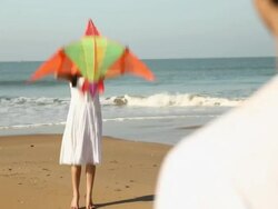 Couple flying kite on the beach  Stock Footage
