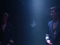 MS Shot of Hunky pilot removing jacket / London, United Kingdom Stock Footage