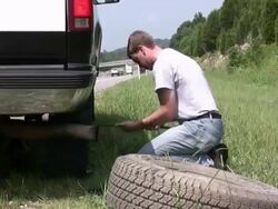 Time lapse of changing a flat tire Stock Footage