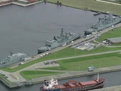 AERIAL Military ships in naval base, Wilhelmshaven, Lower Saxony, Germany Stock Footage