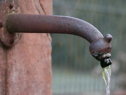  MS Water pouring out from tap of well  /  Kastel-Staadt, Rhineland-Palatinate, Germany Stock Footage