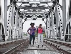 MS Young male and female couple dancing outside in urban area together having fun and smiling / Minneapolis, Minnesota, United States Stock Footage
