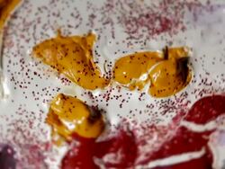 Abstract rotating smiling face with red glitter Stock Footage