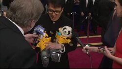 Jackie Chan carrying stuffed panda toys on the Oscars red carpet News Clip