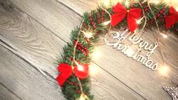 Christmas wreath with decorations on the shabby wooden background Stock Footage